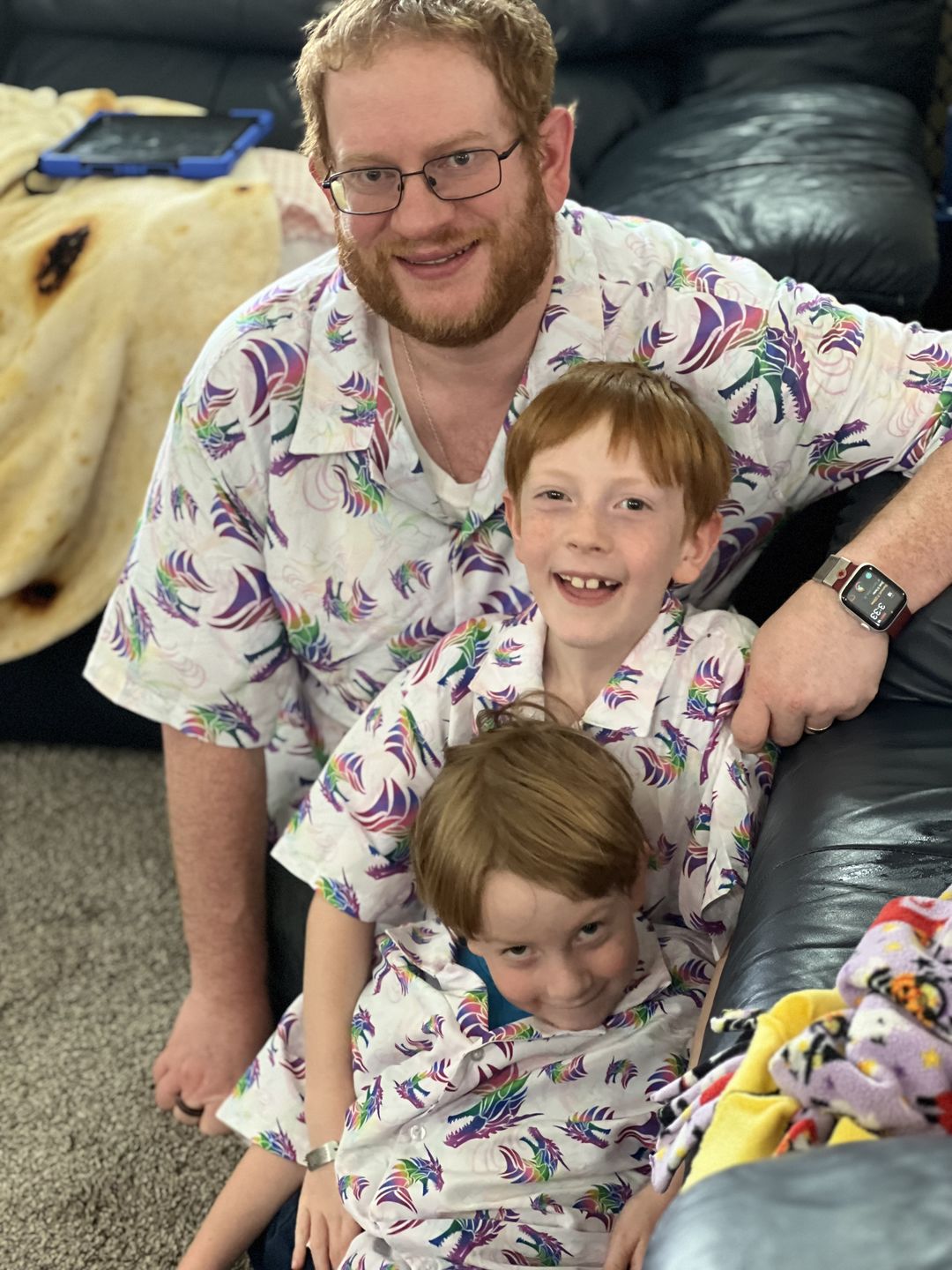 nerd family with children wearing matching button up shirts 