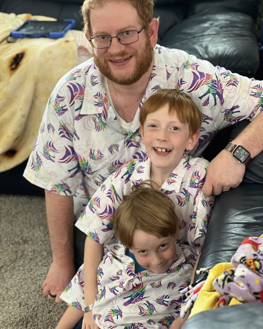 nerd family with children wearing matching button up shirts 